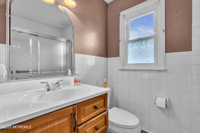 37 Scarborough Pl, Toms River, NJ 08757 - bathroom with toilet, tile walls, wainscoting, vanity, and a shower with shower door