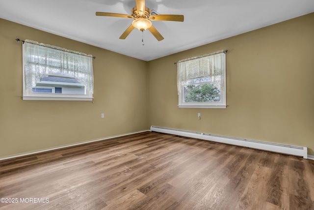 37 Scarborough Pl, Toms River, NJ 08757 - unfurnished room with a baseboard radiator, a ceiling fan, a wealth of natural light, and wood finished floors