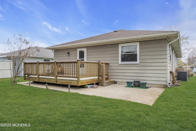 37 Scarborough Pl, Toms River, NJ 08757 - back of property with a shingled roof, a wooden deck, and a lawn