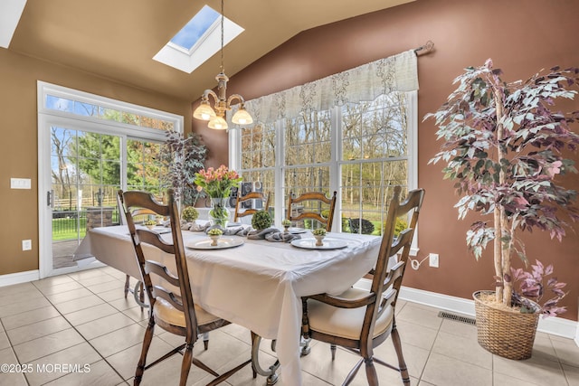 41 Hedgerow Ln, Manalapan, NJ 07726 - dining room featuring visible vents, baseboards, a chandelier, vaulted ceiling with skylight, and light tile patterned floors