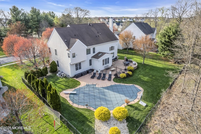 41 Hedgerow Ln, Manalapan, NJ 07726 - rear view of property featuring a fenced in pool, a shingled roof, a fenced backyard, stucco siding, and a patio area