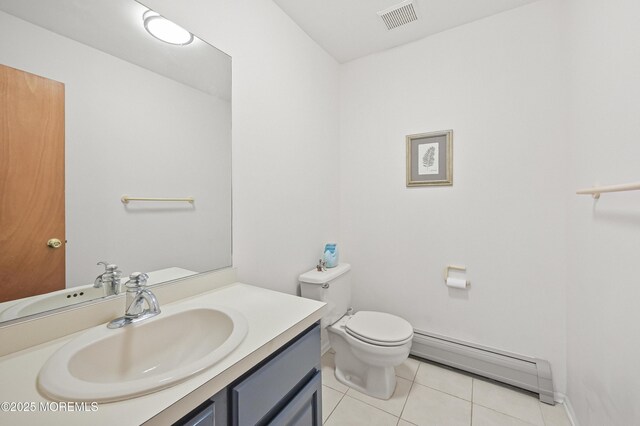 bathroom with tile patterned flooring, visible vents, toilet, vanity, and a baseboard heating unit