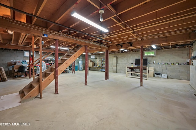 below grade area with water heater and stairway