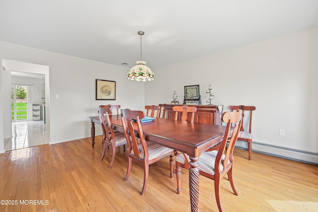 dining space with light wood-style flooring