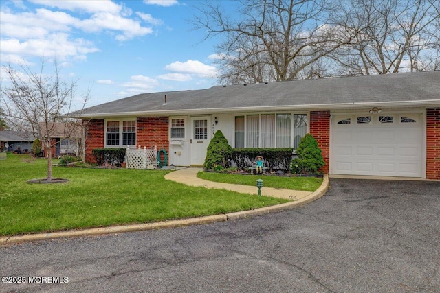 455B Portsmouth Dr, Lakewood, NJ 08701 - ranch-style house with aphalt driveway, brick siding, a front lawn, and an attached garage