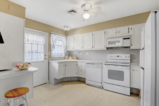 455B Portsmouth Dr, Lakewood, NJ 08701 - kitchen featuring white appliances, light countertops, white cabinetry, visible vents, and ceiling fan