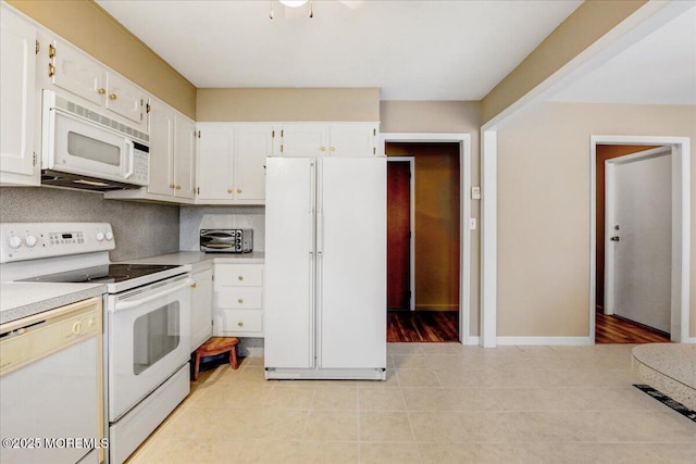 455B Portsmouth Dr, Lakewood, NJ 08701 - kitchen with white cabinetry, light tile patterned flooring, light countertops, and white appliances