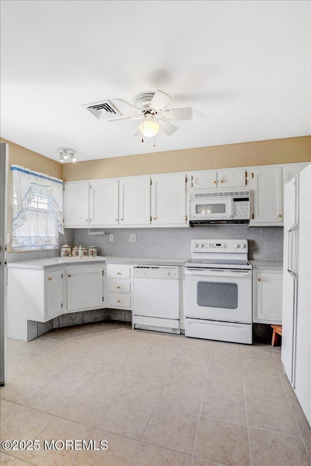 455B Portsmouth Dr, Lakewood, NJ 08701 - kitchen with white cabinetry, white appliances, and visible vents