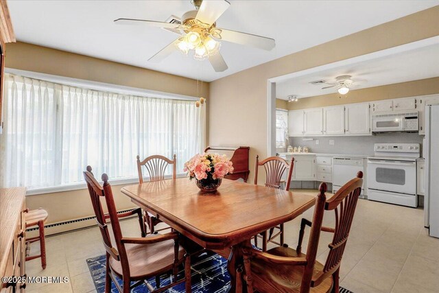 455B Portsmouth Dr, Lakewood, NJ 08701 - dining area with light tile patterned floors, ceiling fan, and plenty of natural light