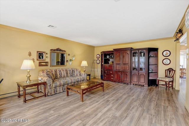 455B Portsmouth Dr, Lakewood, NJ 08701 - living room with light wood-style floors, a baseboard heating unit, ornamental molding, and visible vents
