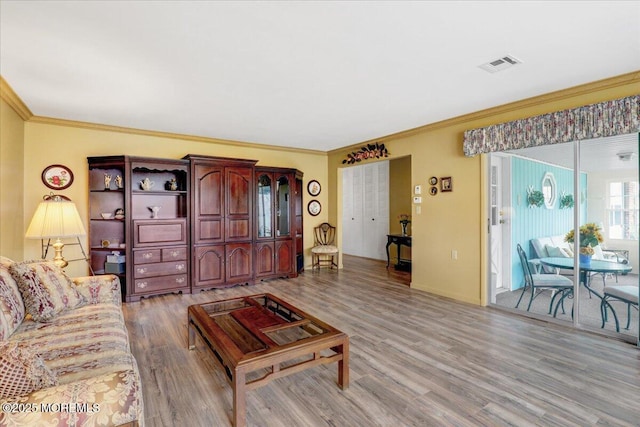 455B Portsmouth Dr, Lakewood, NJ 08701 - living area with light wood-style flooring, ornamental molding, and visible vents