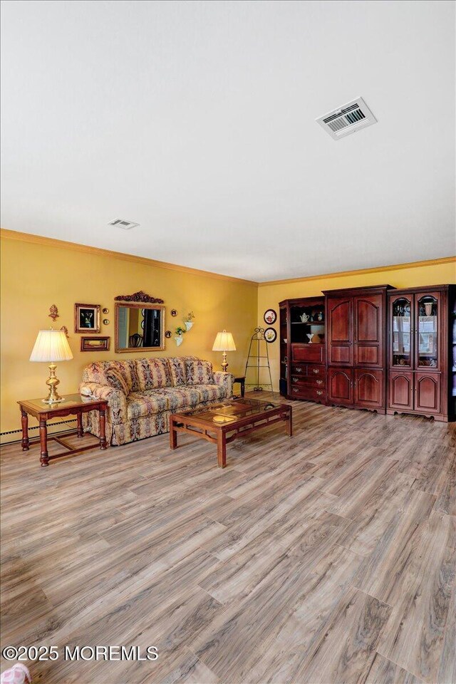 455B Portsmouth Dr, Lakewood, NJ 08701 - living room with crown molding, visible vents, and wood finished floors