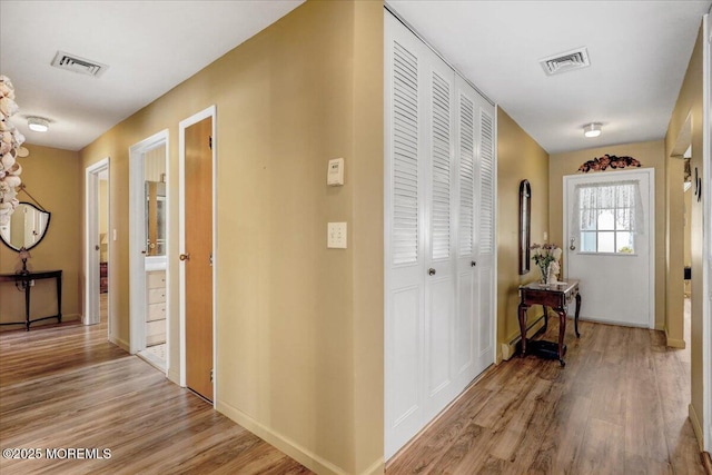 455B Portsmouth Dr, Lakewood, NJ 08701 - hall with light wood-style floors, baseboards, and visible vents