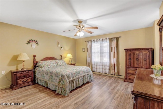 455B Portsmouth Dr, Lakewood, NJ 08701 - bedroom with ceiling fan, a baseboard heating unit, light wood-style floors, and baseboards