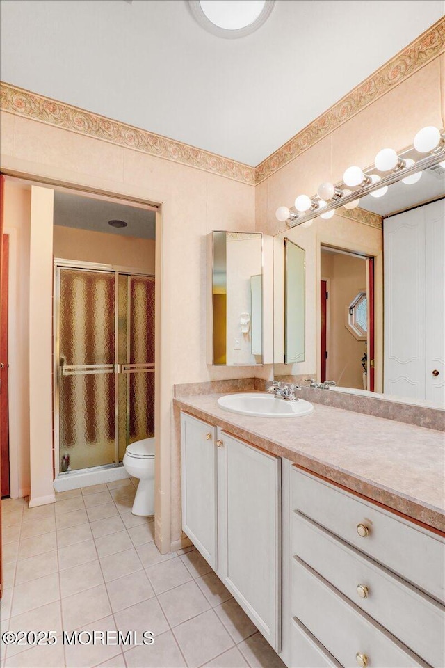 455B Portsmouth Dr, Lakewood, NJ 08701 - full bathroom featuring toilet, tile patterned floors, vanity, and a stall shower