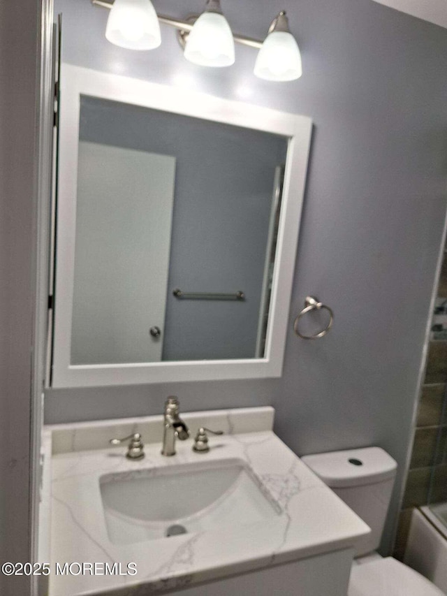 full bathroom with tub / shower combination, toilet, and vanity