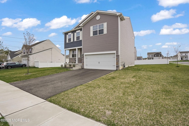 view of front facade with a garage, a front lawn, aphalt driveway, and fence