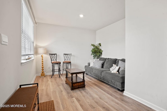 living room with wood finished floors and baseboards