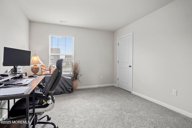 carpeted office with baseboards and visible vents