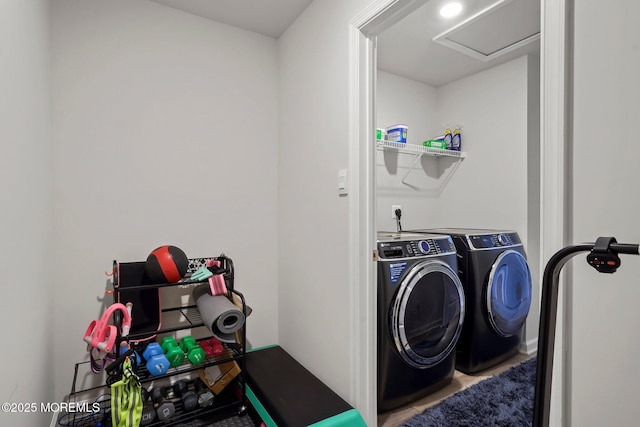 washroom featuring washer and clothes dryer and laundry area