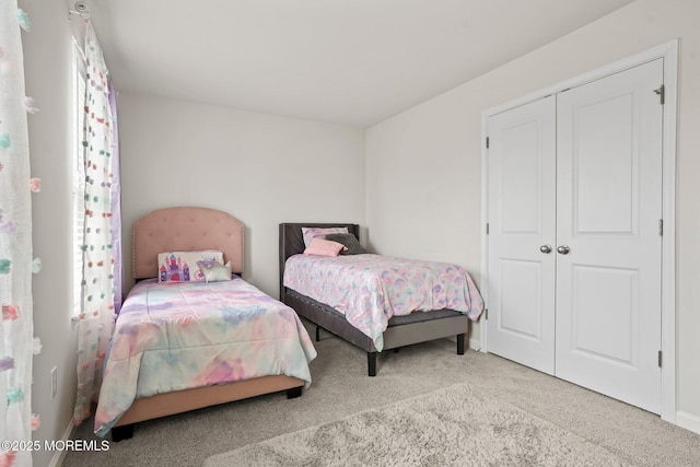 bedroom with baseboards and carpet flooring