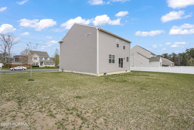 exterior space featuring fence and a yard