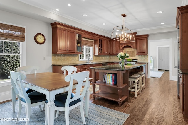 15 Monmouth Ave, Rumson, NJ 07760 - kitchen with dark countertops, open shelves, plenty of natural light, a kitchen island, and ornamental molding