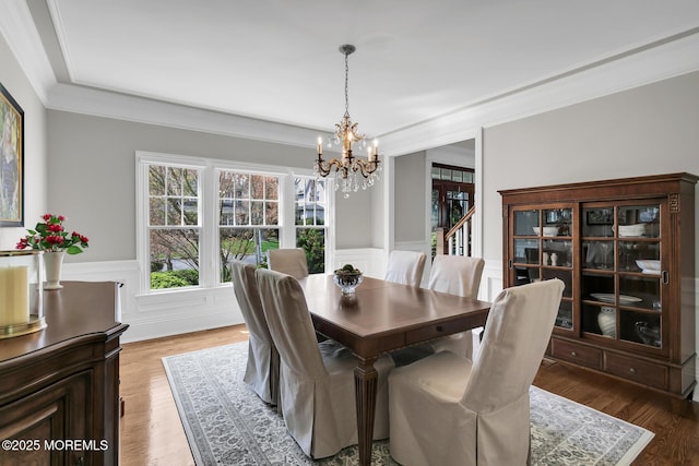 15 Monmouth Ave, Rumson, NJ 07760 - dining room featuring a chandelier, wainscoting, ornamental molding, light wood-style floors, and a decorative wall