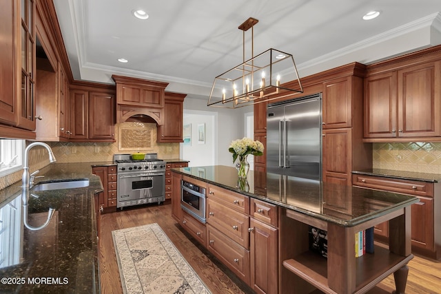 15 Monmouth Ave, Rumson, NJ 07760 - kitchen featuring high end appliances, a sink, open shelves, dark wood-style floors, and a center island