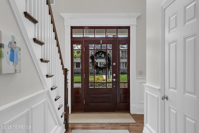 15 Monmouth Ave, Rumson, NJ 07760 - foyer featuring a decorative wall, wood finished floors, wainscoting, and stairway