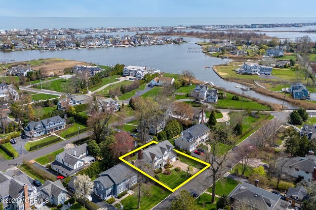 15 Monmouth Ave, Rumson, NJ 07760 - aerial view of property and surrounding area with a large body of water, property parcel outlined, and nearby suburban area