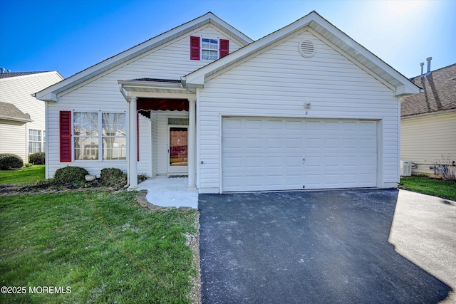 view of front facade with a front lawn, aphalt driveway, and an attached garage