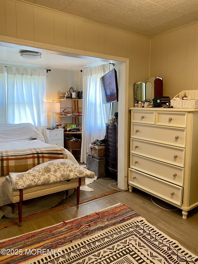 439 Mantoloking Rd, Brick, NJ 08723 - bedroom with a textured ceiling and wood finished floors