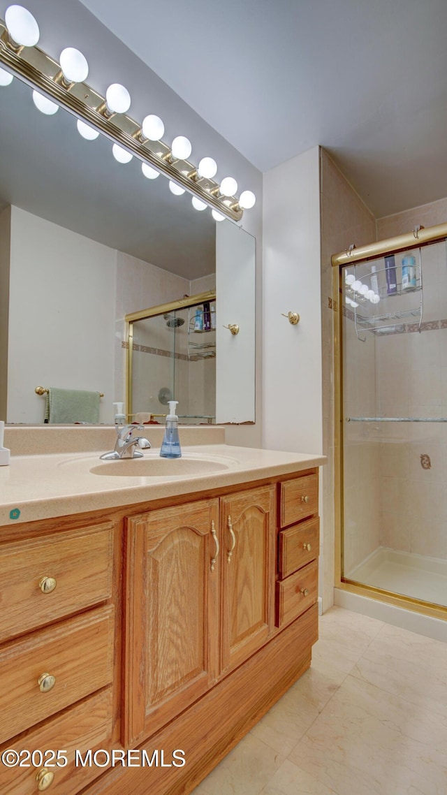 full bath featuring a stall shower and vanity