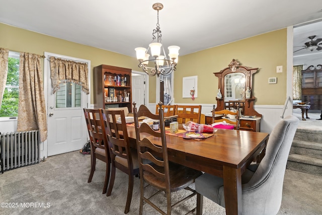 14 S Holmdel Rd, Holmdel, NJ 07733 - dining space featuring light colored carpet, radiator, a chandelier, wainscoting, and ceiling fan