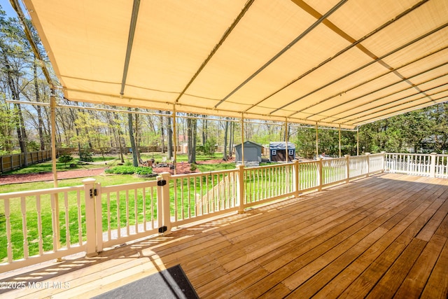 3297 Ridgeway Rd, Manchester, NJ 08759 - wooden deck featuring an outdoor structure, a lawn, fence, and a shed