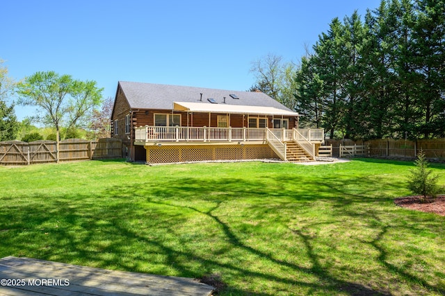 3297 Ridgeway Rd, Manchester, NJ 08759 - rear view of property featuring a wooden deck, log exterior, a fenced backyard, a yard, and stairs