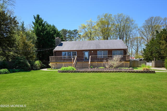3297 Ridgeway Rd, Manchester, NJ 08759 - log-style house with a deck, fence, a chimney, and a front yard