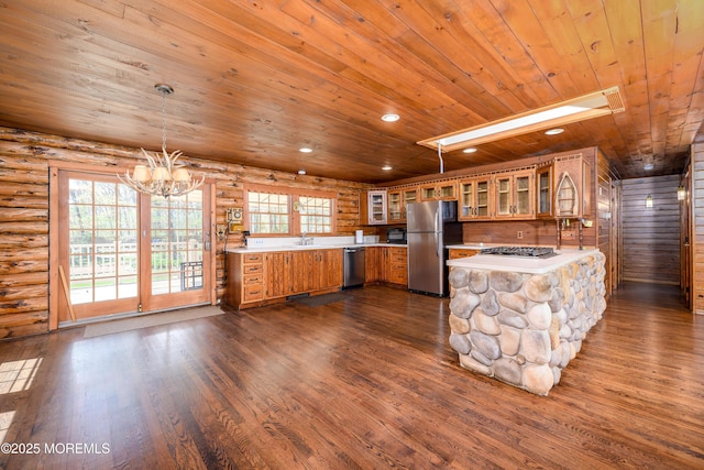 3297 Ridgeway Rd, Manchester, NJ 08759 - kitchen with a sink, brown cabinetry, stainless steel appliances, a peninsula, and wooden ceiling