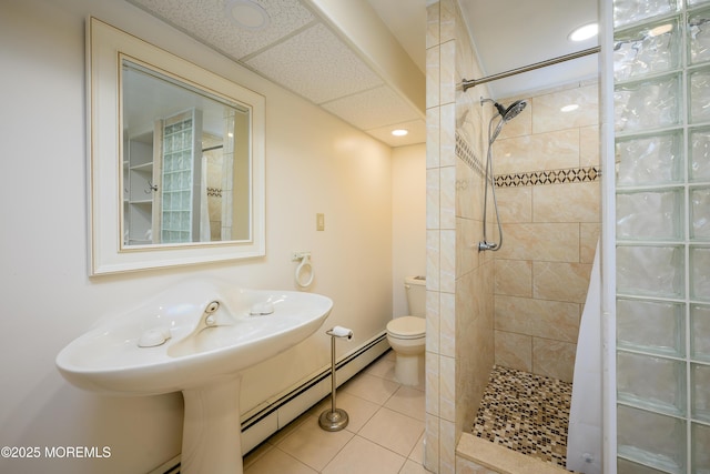 3297 Ridgeway Rd, Manchester, NJ 08759 - full bath with tile patterned floors, a baseboard heating unit, toilet, recessed lighting, and tiled shower