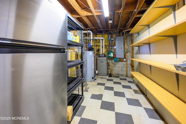 3297 Ridgeway Rd, Manchester, NJ 08759 - unfinished below grade area with freestanding refrigerator, tile patterned floors, gas water heater, and electric panel