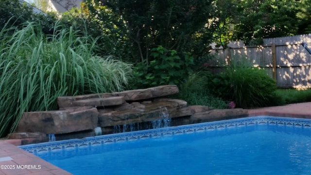 pool featuring fence