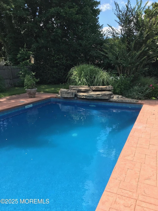 view of pool with fence and a fenced in pool