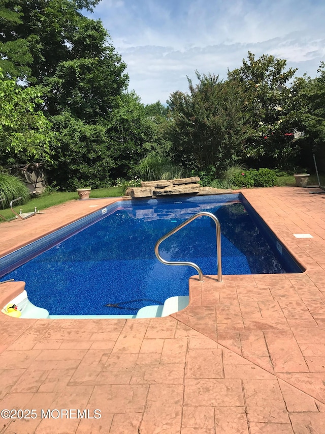 pool with a patio area