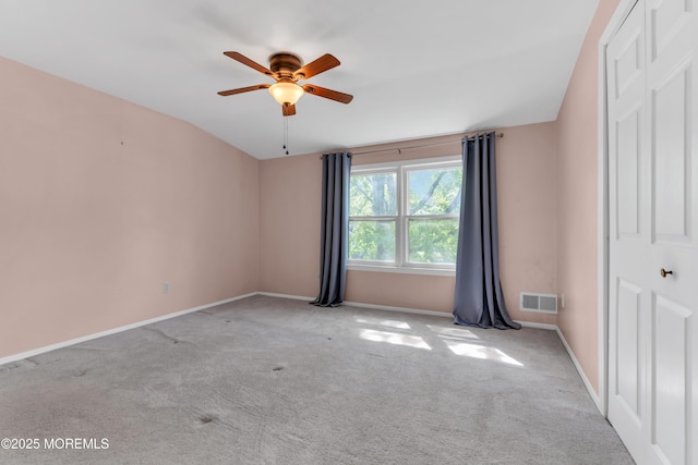 unfurnished bedroom with carpet floors, baseboards, visible vents, and a closet