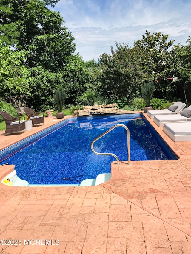 pool featuring a patio area