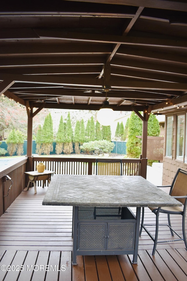 wooden deck with outdoor dining area