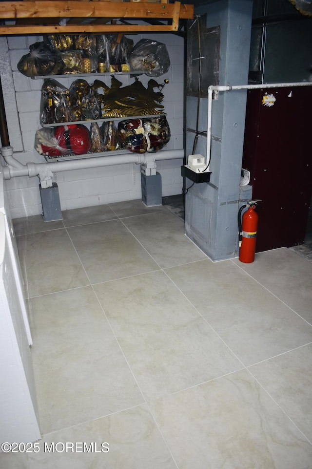 basement featuring tile patterned floors