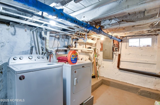 washroom featuring washer and dryer, laundry area, and electric panel