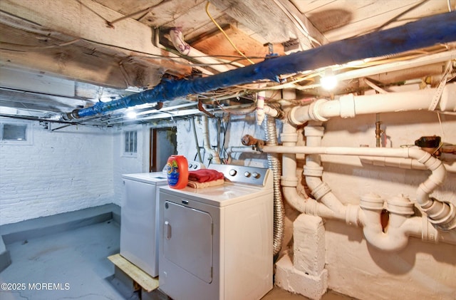 laundry room featuring washer and clothes dryer and laundry area